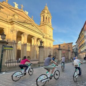 Cycling in Pamplona by the cathedral in Spain's Basque region