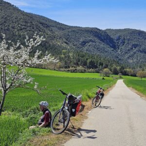 Cyclist resting near Puente Aranas La Rioja wine country Green Spain